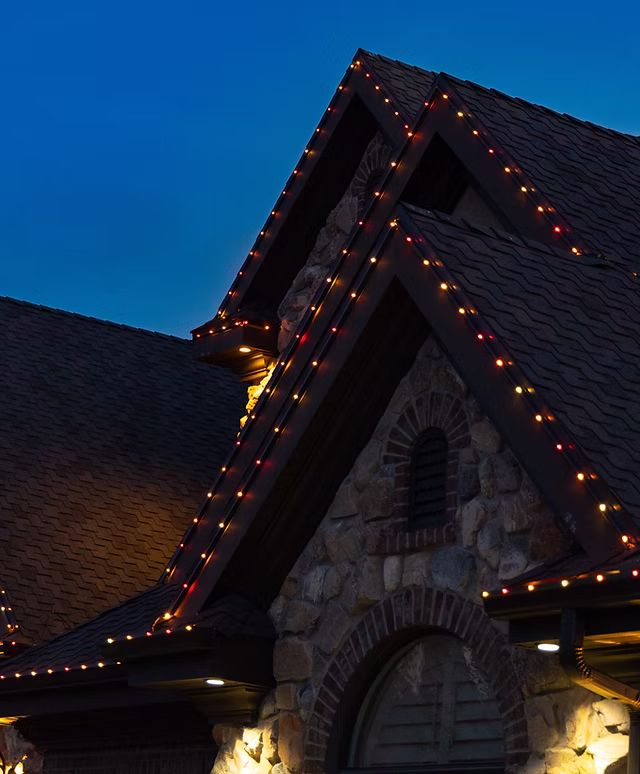 Permanent lighting installation on residential roofline